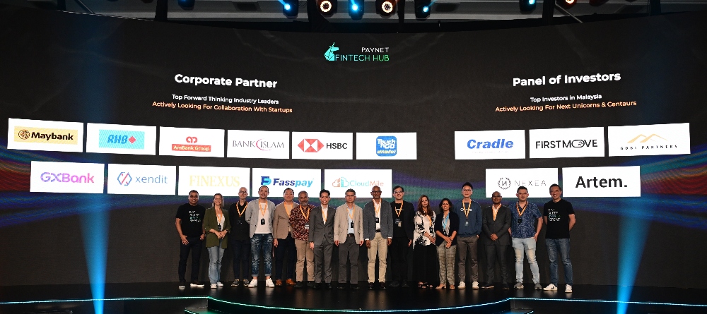 Farhan Ahmad, Group CEO of PayNet, and Gary Yeoh, chief marketing officer at PayNet, pictured with representatives from the panel of corporate partners and Investors.